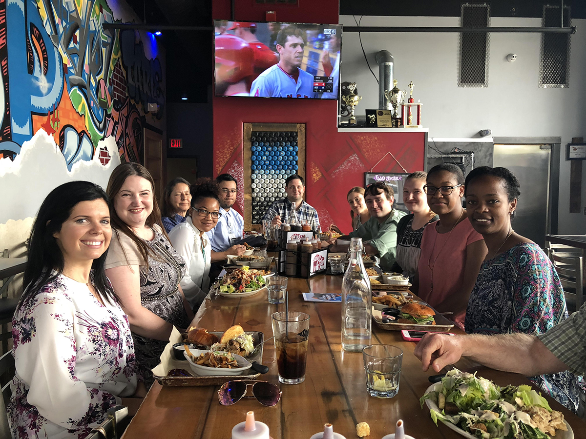 research team together at a table